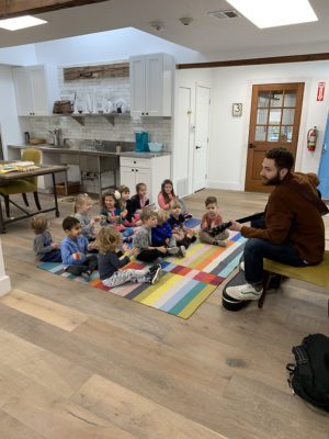 A quiet moment in a Montessori classroom with children working on independent tasks.